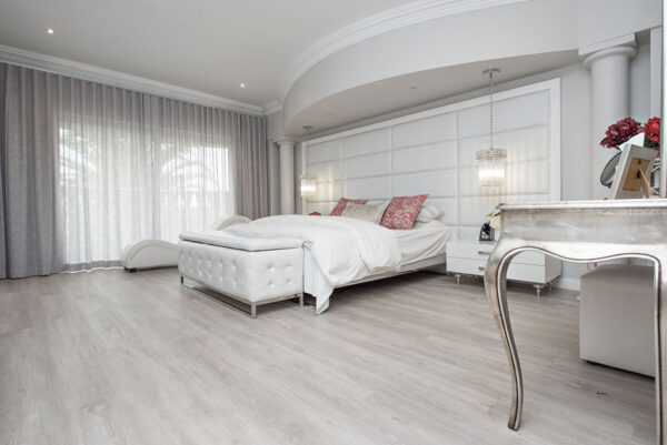 Light Alabaster diamond core vinyl flooring in a bedroom setting